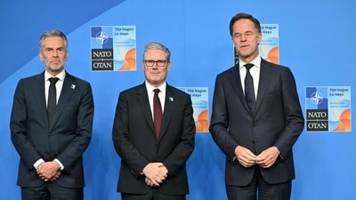 Britain's Prime Minister Keir Starmer (C) poses for a photo with NATO Secretary General Mark Rutte (L) and Netherlands' Prime Minister Dick Schoof during the North Atlantic Treaty Organization (NATO) Heads of State and Government summit in The Hague, on June 25, 2025. NATO leaders hold a two-day summit on June 24 and 25 in The Hague. (Photo by NICOLAS TUCAT / AFP) (AFP) Britain's Prime Minister Keir Starmer (C) poses for a photo with NATO Secretary General Mark Rutte (L) and Netherlands' Prime Minister Dick Schoof during the North Atlantic Treaty Organization (NATO) Heads of State and Government summit in The Hague, on June 25, 2025. NATO leaders hold a two-day summit on June 24 and 25 in The Hague. (Photo by NICOLAS TUCAT / AFP) (AFP)