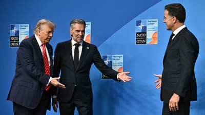 Netherlands' Prime Minister Dick Schoof, center, gestures to President Donald Trump, left, before posing for a picture with NATO Secretary General Mark Rutte during the NATO summit in The Hague, Netherlands, Wednesday, June 25, 2025. (Ben Stansall/Pool Photo via AP) (AP) Netherlands' Prime Minister Dick Schoof, center, gestures to President Donald Trump, left, before posing for a picture with NATO Secretary General Mark Rutte during the NATO summit in The Hague, Netherlands, Wednesday, June 25, 2025. (Ben Stansall/Pool Photo via AP) (AP)