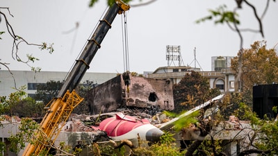 Ahmedabad: A crane being used to clear the debris of the crashed Air India plane, in Ahmedabad, Saturday, June 14, 2025. (PTI) Ahmedabad: A crane being used to clear the debris of the crashed Air India plane, in Ahmedabad, Saturday, June 14, 2025. (PTI)