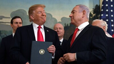 FILE - In this March 25, 2019 file photo, President Donald Trump smiles at Israeli Prime Minister Benjamin Netanyahu, right, after signing a proclamation at the White House in Washington. (AP Photo/Susan Walsh, File) (AP)