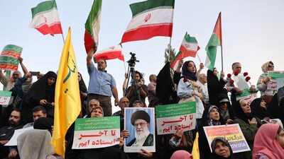 People attend a gathering to support Iran's Armed Forces, after U.S. President Donald Trump announced a ceasefire between Israel and Iran, in Tehran, Iran (via REUTERS)