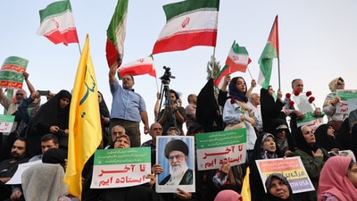 People attend a gathering to support Iran's Armed Forces, after U.S. President Donald Trump announced a ceasefire between Israel and Iran, in Tehran, Iran (via REUTERS)