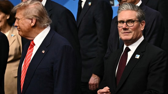 U.S. President Donald Trump stands next to Britain's Prime Minister Keir Starmer as they gather with NATO country leaders for a family photo during the North Atlantic Treaty Organization (NATO) Heads of State and Government summit in The Hague, Netherlands, June 25, 2025. BEN STANSALL/Pool via REUTERS(via REUTERS)