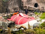 Ahmedabad: Wreckage of the crashed Air India plane being lifted through a crane, in Ahmedabad, Gujarat, Ahmedabad: Wreckage of the crashed Air India plane being lifted through a crane, in Ahmedabad, Gujarat,