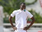 Shamar Joseph of West Indies bites his shirt and smiles during the first day of the 1st test match against Australia at Kensington Oval, Bridgetown, Barbados Shamar Joseph of West Indies bites his shirt and smiles during the first day of the 1st test match against Australia at Kensington Oval, Bridgetown, Barbados