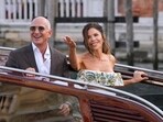 Jeff Bezos, left, and Lauren Sanchez leave a hotel for their pre-wedding reception, in Venice