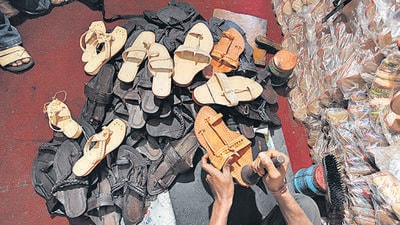 Crossover or cultural theft? The iconic Kolhapuri chappals, handcrafted by generations of artisans in Kolhapur, struts onto the global stage after Prada introduced the footwear during the Milan Fashion Week priced for over  ₹1 Lakh. (Hindustan Times)