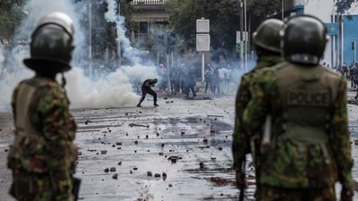 A protester ducks a teargas canister in downtown Nairobi on June 25, 2025, during a protest. (AFP) A protester ducks a teargas canister in downtown Nairobi on June 25, 2025, during a protest. (AFP)