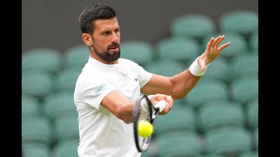 Novak Djokovic during a practice session at the All England Lawn Tennis and Croquet Club, ahead of the Wimbledon Championships in London. (AP) Novak Djokovic during a practice session at the All England Lawn Tennis and Croquet Club, ahead of the Wimbledon Championships in London. (AP)