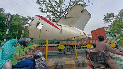 A truck carrying wreckage of the Air India plane that recently crashed into a medical hostel and its canteen complex passes by, in Ahmedabad, Gujarat, Sunday, June 22, 2025. (PTI) A truck carrying wreckage of the Air India plane that recently crashed into a medical hostel and its canteen complex passes by, in Ahmedabad, Gujarat, Sunday, June 22, 2025. (PTI)