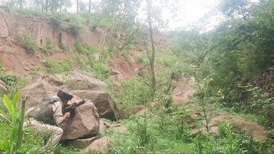 A security personnel during a search operation after an encounter broke out between security forces and terrorists in a remote forested area, in Jammu and Kashmir's Udhampur district, Thursday, June 26, 2025. (PTI) A security personnel during a search operation after an encounter broke out between security forces and terrorists in a remote forested area, in Jammu and Kashmir's Udhampur district, Thursday, June 26, 2025. (PTI)