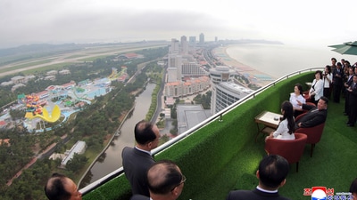 Top view of Kim Jong Un, sitting center, with his wife Ri Sol Ju and daughter looking at the Wonsan-Kalma coastal tourist zone. (AP) Top view of Kim Jong Un, sitting center, with his wife Ri Sol Ju and daughter looking at the Wonsan-Kalma coastal tourist zone. (AP)