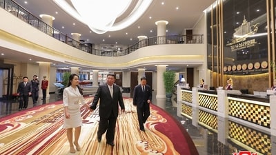 North Korean leader Kim Jong Un walks holding his daughter Kim Ju Ae's hands visiting the Wonsan Kalma coastal tourist area in Kangwon Province. (AFP) North Korean leader Kim Jong Un walks holding his daughter Kim Ju Ae's hands visiting the Wonsan Kalma coastal tourist area in Kangwon Province. (AFP)