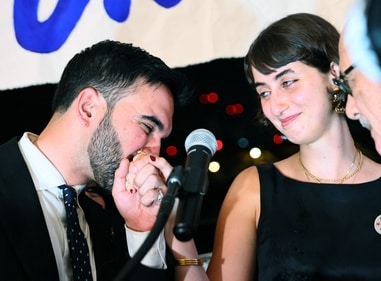 New York mayoral candidate, State Rep. Zohran Mamdani (D-NY) kisses the hand of his wife Rama Duwaji as they celebrate during an election night gathering at The Greats of Craft LIC on June 24, 2025 in the Long Island City neighborhood of the Queens borough in New York City. (AFP) New York mayoral candidate, State Rep. Zohran Mamdani (D-NY) kisses the hand of his wife Rama Duwaji as they celebrate during an election night gathering at The Greats of Craft LIC on June 24, 2025 in the Long Island City neighborhood of the Queens borough in New York City. (AFP)