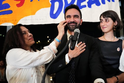 Zohran Mamdani reacts next to his mother Mira Nair, a filmmaker. (Reuters)