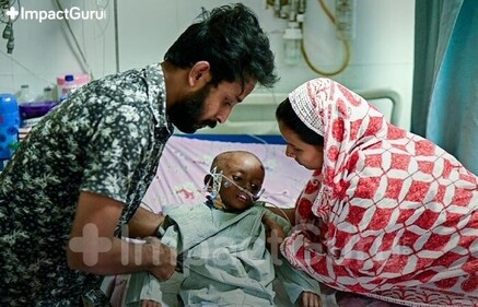 [In frame: Izaz with his parents as he gets treated in the hospital]