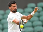 Novak Djokovic during a training session. Novak Djokovic during a training session.