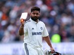 India's Rishabh Pant walks off after being caught by England's Zak Crawley off the bowling of Shoaib Bashir 