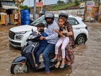 Commuters move through a waterlogged road after heavy rainfall, at Jhotwara area, in Jaipur, Rajasthan. Commuters move through a waterlogged road after heavy rainfall, at Jhotwara area, in Jaipur, Rajasthan.