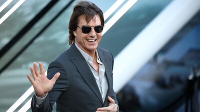 Prince Harry and Meghan Markle feel snubbed by Tom Cruise, who has bonded with the British royal family. (Photo by HENRY NICHOLLS / AFP) (AFP) Prince Harry and Meghan Markle feel snubbed by Tom Cruise, who has bonded with the British royal family. (Photo by HENRY NICHOLLS / AFP) (AFP)