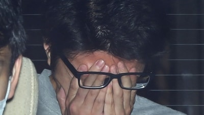 This file photo taken on November 1, 20217 shows suspect Takahiro Shiraishi covering his face with his hands as he is transported to the prosecutor's office from a police station in Tokyo. (AFP) This file photo taken on November 1, 20217 shows suspect Takahiro Shiraishi covering his face with his hands as he is transported to the prosecutor's office from a police station in Tokyo. (AFP)