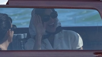 Lauren Sanchez waved with a wide grin as she settled into a taxi boat, heading to the church in Venice on Friday, June 27, 2025. (AP Photo/Antonio Calanni) (AP) Lauren Sanchez waved with a wide grin as she settled into a taxi boat, heading to the church in Venice on Friday, June 27, 2025. (AP Photo/Antonio Calanni) (AP)