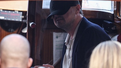 Leonardo DiCaprio sits in a boat, ahead of the anticipated wedding of Amazon founder Jeff Bezos and journalist Lauren Sanchez in Venice, Italy, June 26, 2025. (REUTERS)