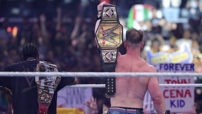 John Cena (R) celebrates with rapper Travis Scott after defeating Cody Rhodes for the Undisputed WWE Championship during WrestleMania 41 at Allegiant Stadium on April 20, 2025 in Las Vegas, Nevada. (Getty Images via AFP) John Cena (R) celebrates with rapper Travis Scott after defeating Cody Rhodes for the Undisputed WWE Championship during WrestleMania 41 at Allegiant Stadium on April 20, 2025 in Las Vegas, Nevada. (Getty Images via AFP)