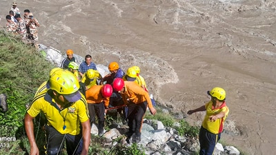 Rudraprayag: SDRF personnel carry out rescue work after a tempo traveller carrying pilgrims fell into the Alaknanda River, in Rudraprayag district, Uttarakhand, Thursday, June 26, 2025. At least two people were killed and eight injured in the accident. (PTI) Rudraprayag: SDRF personnel carry out rescue work after a tempo traveller carrying pilgrims fell into the Alaknanda River, in Rudraprayag district, Uttarakhand, Thursday, June 26, 2025. At least two people were killed and eight injured in the accident. (PTI)