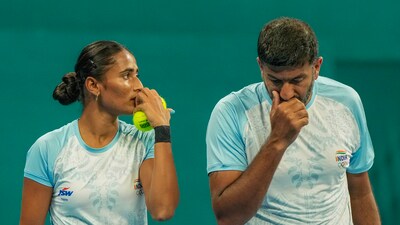 India's Rohan Bopanna and Rutuja Sampatrao Bhosale during the Mixed Doubles Final tennis match (PTI) India's Rohan Bopanna and Rutuja Sampatrao Bhosale during the Mixed Doubles Final tennis match (PTI)