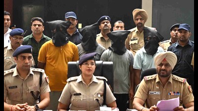 The accused in police custody in Chandigarh on Friday. (Keshav Singh/HT)