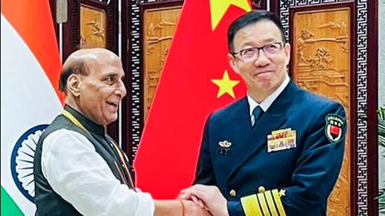 Defence minister Rajnath Singh meets Chinese defence minister Admiral Dong Jun on sidelines of SCO Defence Ministers’ Meeting, in Qingdao on Thursday. (ANI)