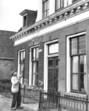 A knocker-upper uses a long pole to wake workers in the Netherlands. (Wikimedia) A knocker-upper uses a long pole to wake workers in the Netherlands. (Wikimedia)