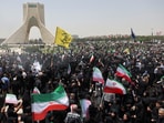 People attend the funeral procession of Iranian military commanders, nuclear scientists and others killed in Israeli strikes in Tehran.