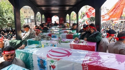 The state funeral proceedings in Tehran for 60 nuclear scientists and military commanders killed in Israeli strikes are set to begin at 8:00 am (0430 GMT) at Enghelab Square. (AFP) The state funeral proceedings in Tehran for 60 nuclear scientists and military commanders killed in Israeli strikes are set to begin at 8:00 am (0430 GMT) at Enghelab Square. (AFP)