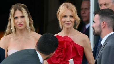 Worst dressed: Jewel Kilcher's primary red gown, with its bold floral details, gave off more Kentucky Derby vibes than wedding elegance. (Photo by Marco BERTORELLO / AFP) (AFP) Worst dressed: Jewel Kilcher's primary red gown, with its bold floral details, gave off more Kentucky Derby vibes than wedding elegance. (Photo by Marco BERTORELLO / AFP) (AFP)