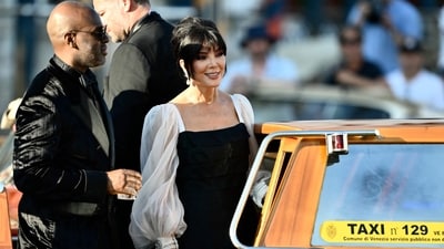 Worst dressed: Kris Jenner's black dress with white puffed sleeves missed the mark, looking more like an everyday outfit than something fit for a wedding. (Photo by Marco BERTORELLO / AFP) (AFP) Worst dressed: Kris Jenner's black dress with white puffed sleeves missed the mark, looking more like an everyday outfit than something fit for a wedding. (Photo by Marco BERTORELLO / AFP) (AFP)