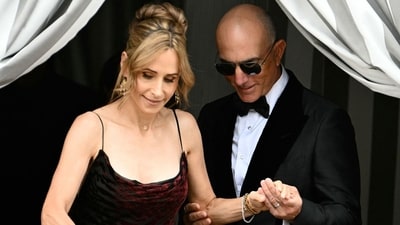 Mark Bezos with his wife Lisa Bezos at the wedding of Jeff Bezos in Venice. (Image: AFP via Getty Images) Mark Bezos with his wife Lisa Bezos at the wedding of Jeff Bezos in Venice. (Image: AFP via Getty Images)
