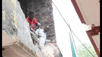 MCworkers at work in Basti Gujan area of Jalandhar on Saturday.