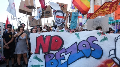 Demonstrators raised anti-Bezos and anti-Elon Musk slogans with flags in their hands. (REUTERS)