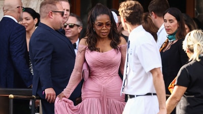 Best Dressed: Oprah Winfrey graced the wedding in a pale pink wrap dress, paired with matching sunglasses, perfectly capturing the essence of a summer celebration. REUTERS/Yara Nardi (REUTERS)