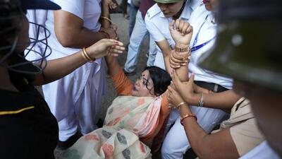 Police detain a BJP supporter ruling Bharatiya Janata Party during a protest over the alleged rape of a student at the South Calcutta Law College campus on Wednesday, in Kolkata, on Saurday. (AP) Police detain a BJP supporter ruling Bharatiya Janata Party during a protest over the alleged rape of a student at the South Calcutta Law College campus on Wednesday, in Kolkata, on Saurday. (AP)
