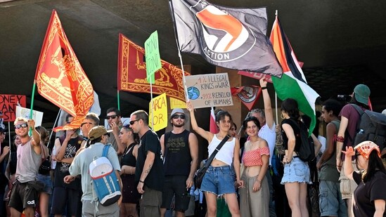 People take part in a protest 'No Space for Bezos' a day after the wedding ceremony of Jeff Bezos and Lauren Sanchez in Venice, at Venice's train station on June 28, 2025. (Photo by ANDREA PATTARO / AFP)(AFP)