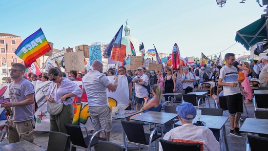 This week, they joined Greenpeace and the British group “Everyone Hates Elon,” which demolished Tesla vehicles in opposition to Elon Musk, in erecting a massive banner in Saint Mark's Square against the tax breaks for wealthy.(AP)