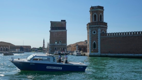 Police patrol the water in front of the Venice Arsenale in Venice, Italy, Saturday, June 28, 2025. (AP Photo/Luca Bruno)(AP)