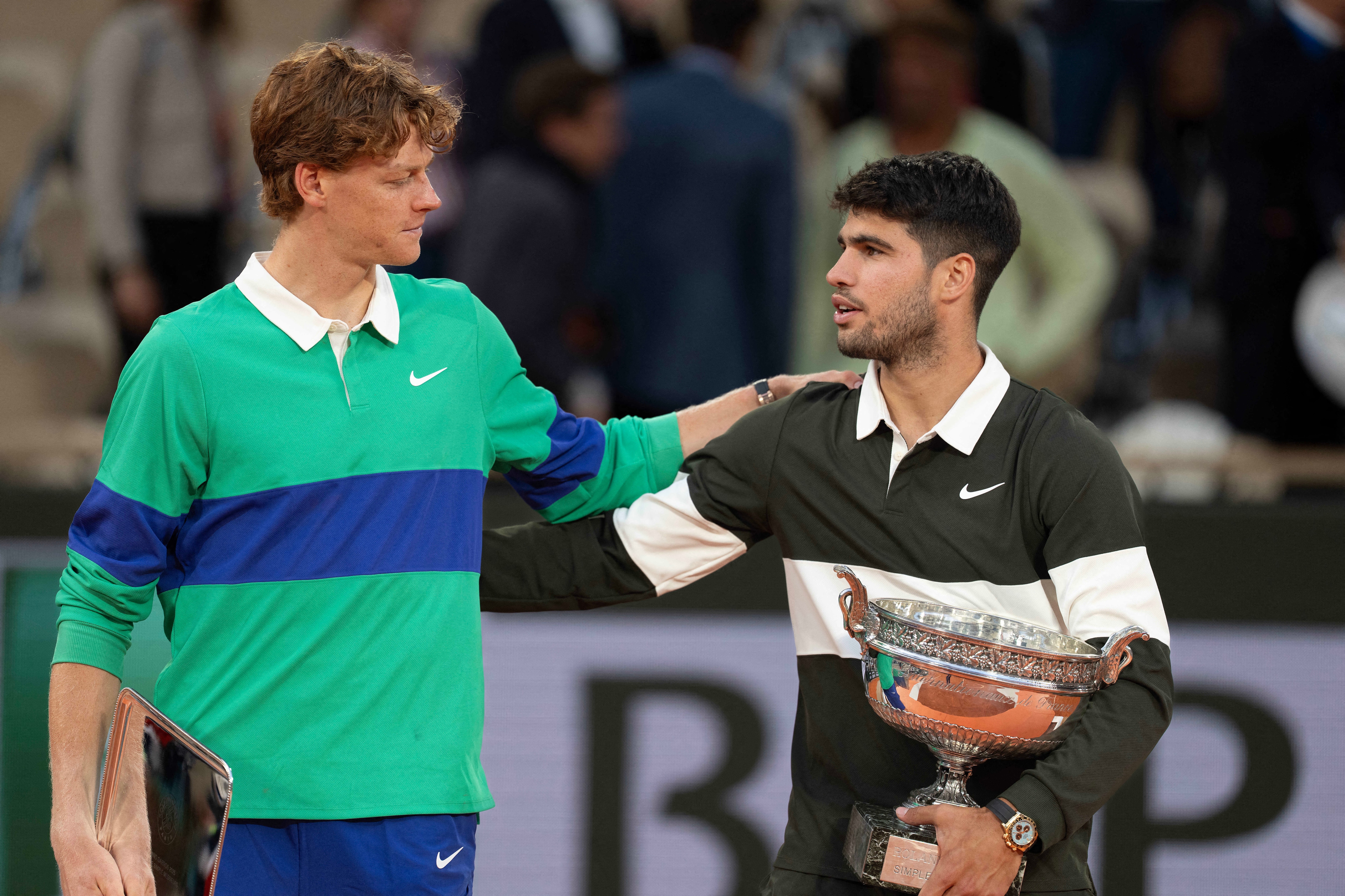 French Open; Jannik Sinner of Italy and Carlos Alcaraz of Spain pose together at the trophy presentation. (IMAGN IMAGES via Reuters Connect)