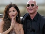 Lauren Sanchez Bezos, left, and Jeff Bezos depart from the Aman hotel during wedding celebrations in Venice, Italy, Saturday, June 28, 2025. (AP/PTI)(AP06_29_2025_000003B) Lauren Sanchez Bezos, left, and Jeff Bezos depart from the Aman hotel during wedding celebrations in Venice, Italy, Saturday, June 28, 2025. (AP/PTI)(AP06_29_2025_000003B)