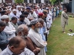 Residents and relatives offer funeral prayers for the victims who died in flash floods in Sialkot, in Punjab province, on June 28, 2025. 