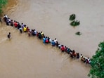 Police rescue students trapped in a residential school after its premises got flooded due to heavy rain, in East Singhbhum district, Jharkhand. (PTI)