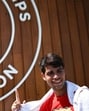 Spain's Carlos Alcaraz shows a Wimbledon sign as he leaves court after warming up during the 2025 Wimbledon Championships at The All England Lawn Tennis and Croquet Club in Wimbledon, southwest London, on June 29, 2025. (Photo by HENRY NICHOLLS / AFP) / RESTRICTED TO EDITORIAL USE (AFP)